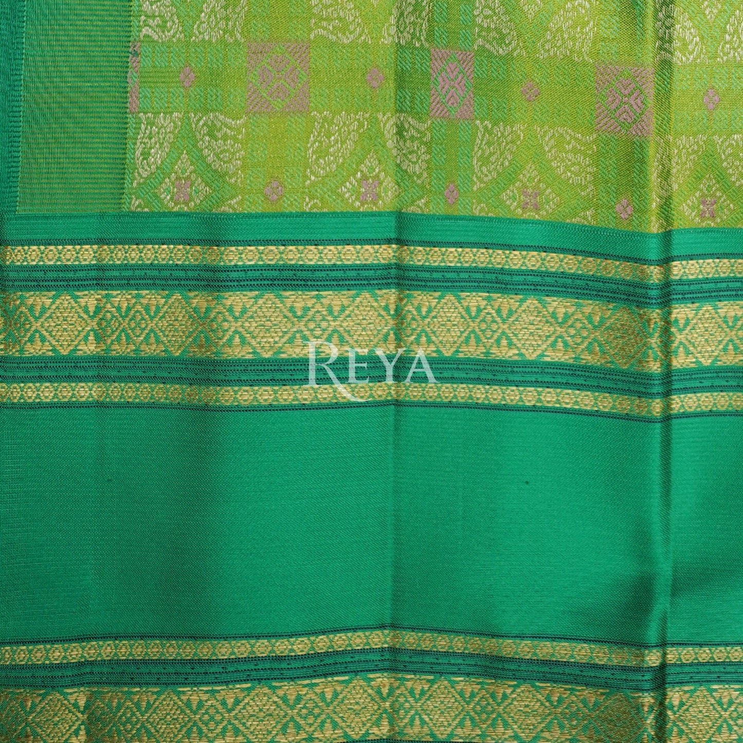 'Emerald Enchantress Kanjeevaram' in parrot green and temple gold