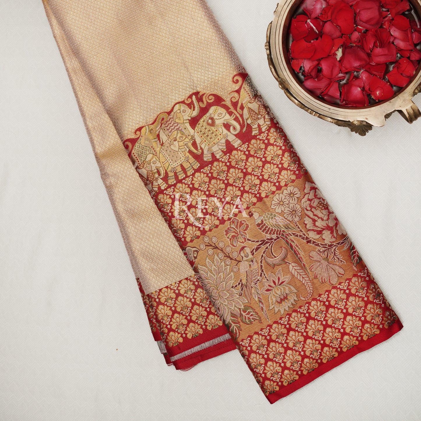 'Royal Elephant Parade  Kanjeevaram' in temple red and  rose gold