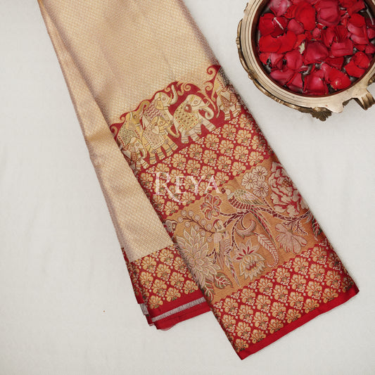 'Royal Elephant Parade  Kanjeevaram' in temple red and  rose gold