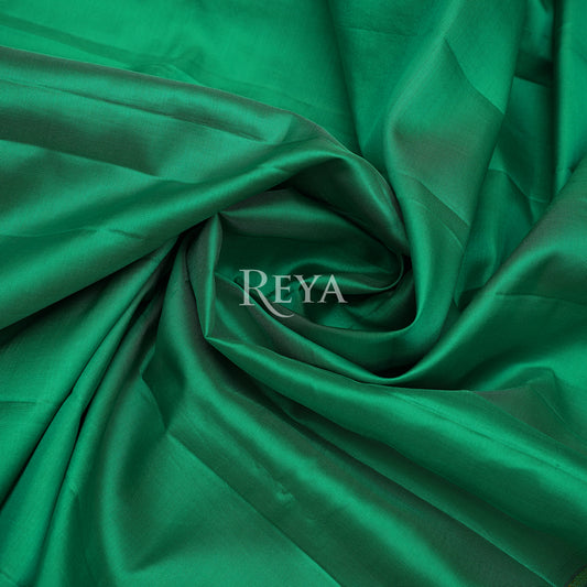 'Emerald Enchantress Kanjeevaram' in parrot green and temple gold