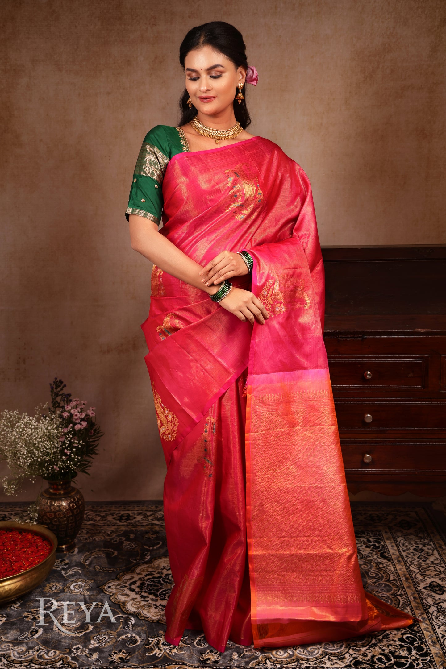 Radiant Ruby Kanjeevaram' in pink and gold zari florals