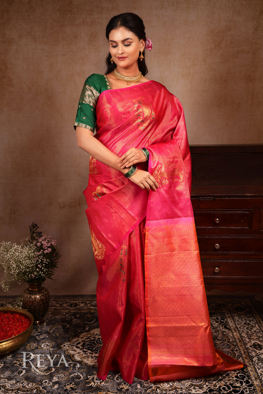 Radiant Ruby Kanjeevaram' in pink and gold zari florals