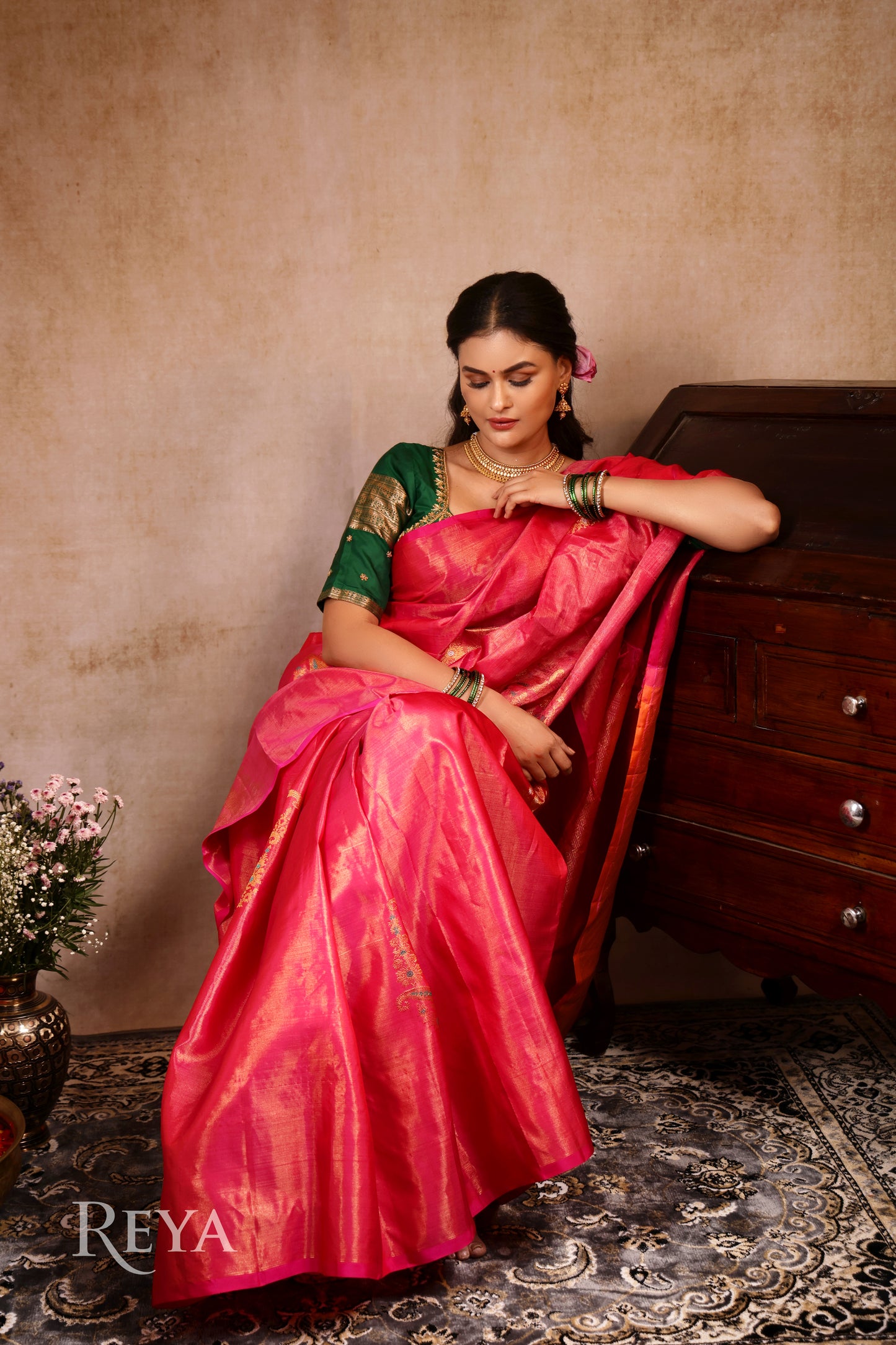 Radiant Ruby Kanjeevaram' in pink and gold zari florals