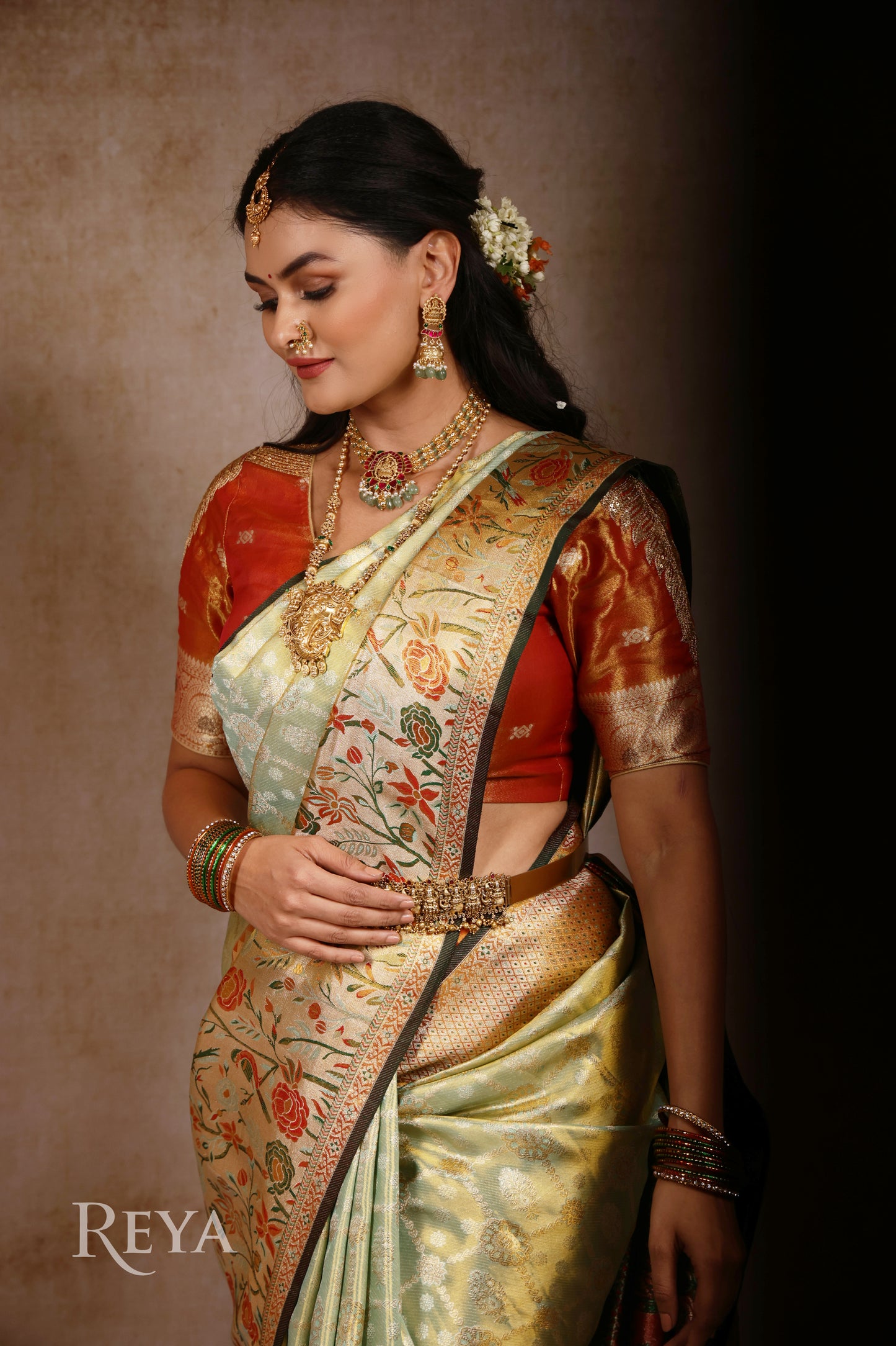 'Song of the Silk Garden Kanjeevaram' in pistachio green and meenakari hues